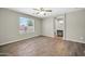 Large bedroom with laminate floors, a ceiling fan, and plenty of natural light at 12938 W Mandalay Ln, El Mirage, AZ 85335
