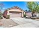 Charming single story home featuring a two-car garage, low maintenance landscaping, and a neutral color palette at 12938 W Mandalay Ln, El Mirage, AZ 85335