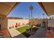 Backyard with desert landscaping, artificial turf, and seating area at 13211 W Aleppo Dr, Sun City West, AZ 85375