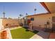 Backyard with desert landscaping, artificial turf, and outdoor seating at 13211 W Aleppo Dr, Sun City West, AZ 85375