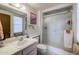 Bathroom featuring neutral tile floors, a shower, and a mirror at 13211 W Aleppo Dr, Sun City West, AZ 85375