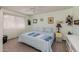 Bedroom featuring soft-green walls, carpet floors, and a ceiling fan at 13211 W Aleppo Dr, Sun City West, AZ 85375