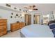 Bedroom featuring a ceiling fan, carpet floors, and two closets at 13211 W Aleppo Dr, Sun City West, AZ 85375
