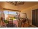 The covered patio has comfortable seating and a view of the back yard at 13211 W Aleppo Dr, Sun City West, AZ 85375