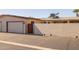 Exterior view of property featuring a garage, brick wall, and desert landscaping at 13211 W Aleppo Dr, Sun City West, AZ 85375