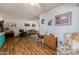 Spacious living room with open layout and wood-look flooring at 13211 W Aleppo Dr, Sun City West, AZ 85375