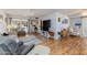 Inviting living room with wood floors, a ceiling fan, and natural light at 13211 W Aleppo Dr, Sun City West, AZ 85375