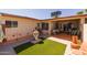 This cozy patio has artifical turf, a decorative rock garden, and lots of chairs for relaxing with friends and Gathering at 13211 W Aleppo Dr, Sun City West, AZ 85375