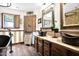 Rustic bathroom with copper sinks, wood cabinets, and wood shutters over the window at 1338 W Mountain View Dr, Mesa, AZ 85201