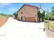 Large two-story home featuring a basketball hoop, ample driveway space, and lush greenery at 1338 W Mountain View Dr, Mesa, AZ 85201