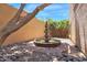 Charming courtyard featuring a beautiful tiered fountain surrounded by river rock at 1338 W Mountain View Dr, Mesa, AZ 85201