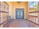Grand arched double-door entryway with iron detailing and wooden porch at 1338 W Mountain View Dr, Mesa, AZ 85201