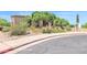Inviting home exterior with mature trees and desert landscaping at 1338 W Mountain View Dr, Mesa, AZ 85201