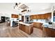 Open kitchen layout with stainless steel refrigerator, marble countertops and plenty of storage space at 1338 W Mountain View Dr, Mesa, AZ 85201