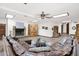 Large living room featuring a brick fireplace, hard wood floors and a leather couch at 1338 W Mountain View Dr, Mesa, AZ 85201