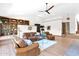 Bright living room with vaulted ceilings, hardwood floors, and custom bookshelves at 1338 W Mountain View Dr, Mesa, AZ 85201