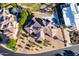 Aerial view showcases this home's tile roof, beautiful backyard pool, patio, and mature landscaping at 14123 W Greentree S Dr, Litchfield Park, AZ 85340