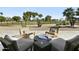 This inviting backyard features a fire pit and chairs for outdoor relaxation and entertainment at 14123 W Greentree S Dr, Litchfield Park, AZ 85340