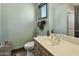 This bathroom has a single sink vanity with a medicine cabinet mirror and a shower-tub combo at 14123 W Greentree S Dr, Litchfield Park, AZ 85340