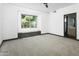 Empty bedroom with lots of natural light and a doorway to the bathroom at 14123 W Greentree S Dr, Litchfield Park, AZ 85340