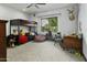 Cozy ' bedroom with bunk beds, a window seat, and comfortable decor at 14123 W Greentree S Dr, Litchfield Park, AZ 85340