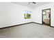 Empty bedroom with lots of natural light and a doorway to the bathroom at 14123 W Greentree S Dr, Litchfield Park, AZ 85340