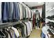 Spacious walk-in closet with organized clothing racks and shelving, ideal for storage and organization at 14123 W Greentree S Dr, Litchfield Park, AZ 85340