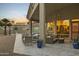 Relaxing covered patio featuring comfortable seating, ceiling fan, and views of the serene landscape at 14123 W Greentree S Dr, Litchfield Park, AZ 85340