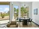 Dining area with table and chairs, and a view of the golf course at 14123 W Greentree S Dr, Litchfield Park, AZ 85340