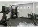 Home gym features a bike, weight machines, a mirrored wall and multiple free weights at 14123 W Greentree S Dr, Litchfield Park, AZ 85340