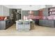 Stylish kitchen featuring a large island, sleek cabinets, and stainless steel appliances at 14123 W Greentree S Dr, Litchfield Park, AZ 85340