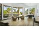 Bright living area with large windows and view of golf course at 14123 W Greentree S Dr, Litchfield Park, AZ 85340