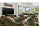 Comfortable living room with large sectional sofa and view to outdoor patio at 14123 W Greentree S Dr, Litchfield Park, AZ 85340