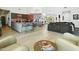Bright living space with a kitchen island, modern appliances, and a cozy seating area at 14123 W Greentree S Dr, Litchfield Park, AZ 85340