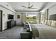 Large main bedroom with seating area, plush bed, and neutral tones at 14123 W Greentree S Dr, Litchfield Park, AZ 85340