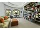 Bright home office with built in bookshelves and a view of the outside at 14123 W Greentree S Dr, Litchfield Park, AZ 85340