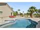 Beautiful pool and spa with plenty of lounge chairs and mature landscaping at 14123 W Greentree S Dr, Litchfield Park, AZ 85340