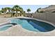 Relax and unwind in this private pool and spa area with lush landscaping at 14123 W Greentree S Dr, Litchfield Park, AZ 85340