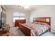Bedroom with neutral carpet and paint, ceiling fan, and dresser at 14300 W Bell Rd # 100, Surprise, AZ 85374
