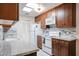 Updated kitchen with granite counters and white appliances at 14300 W Bell Rd # 100, Surprise, AZ 85374