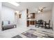 Open-concept living room with view to the kitchen and dining area at 14300 W Bell Rd # 100, Surprise, AZ 85374