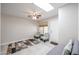 Inviting living room featuring a ceiling fan, skylight, and tile flooring at 14300 W Bell Rd # 100, Surprise, AZ 85374