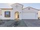 Charming single-Gathering home featuring a two-car garage and beautiful white stucco exterior at 16367 W Desert Mirage Dr, Surprise, AZ 85388