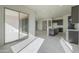 Modern kitchen featuring an island with dark cabinets and stainless-steel appliances at 16367 W Desert Mirage Dr, Surprise, AZ 85388