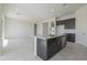 Modern kitchen island with granite countertop and convenient sink at 16367 W Desert Mirage Dr, Surprise, AZ 85388