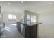 Stylish kitchen island with granite countertop, perfect for entertaining at 16367 W Desert Mirage Dr, Surprise, AZ 85388