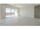 Open living area with large sliding glass doors providing access to the backyard at 16367 W Desert Mirage Dr, Surprise, AZ 85388