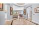 Elegant foyer with an open floor plan, arched doorways, and access to the living room and dining area at 16432 S Mountain Stone Trl, Phoenix, AZ 85048