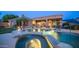 Inviting backyard with a pool, spa, and covered patio, perfect for outdoor relaxation and entertainment at 16432 S Mountain Stone Trl, Phoenix, AZ 85048