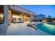 Inviting backyard featuring a sparkling pool, patio seating, and desert landscaping perfect for outdoor relaxation at 16432 S Mountain Stone Trl, Phoenix, AZ 85048